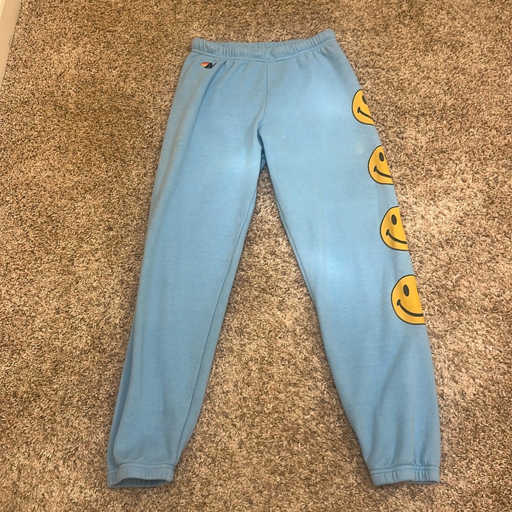 Aviator Nation Medium Light Blue Track Joggers with Yellow Smiley Faces - Picture 2 of 9